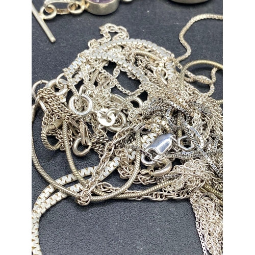 404 - Ten vintage silver necklaces and a silver bracelet 96 gms