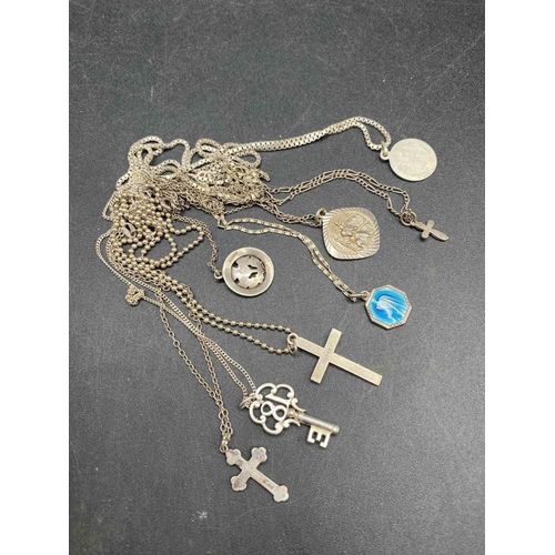 407 - Seven silver religious pendant necklaces