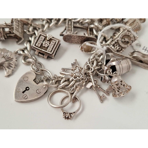 413 - A silver charm bracelet 7 inch 108 gms