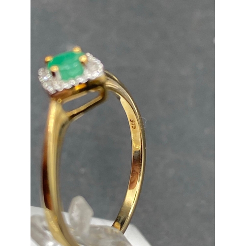 463 - A pretty emerald and diamond dress ring 9ct size P