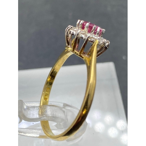 466 - A ruby and diamond cluster ring 18ct gold size O