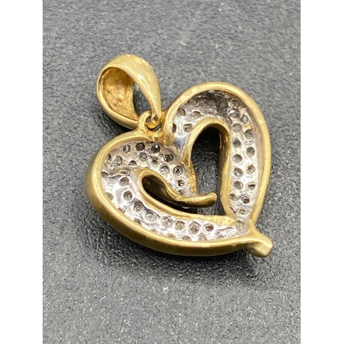 469 - A diamond loop heart pendant 14ct gold