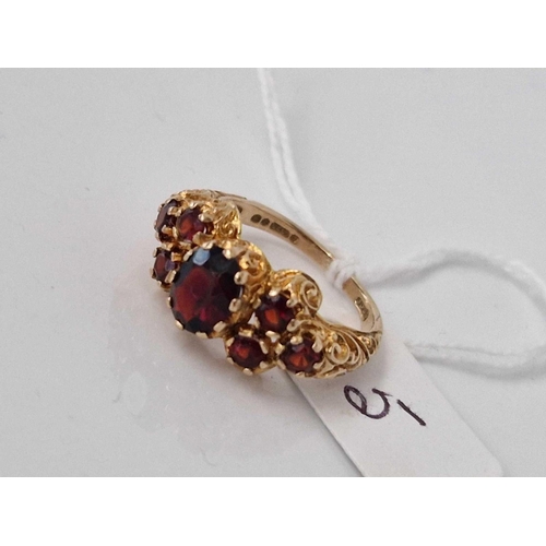 5 - A seven stone garnet ring 9ct size P 4.2 gms