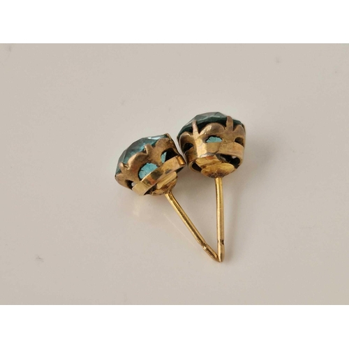 515 - A pair of gold blue zircon earrings