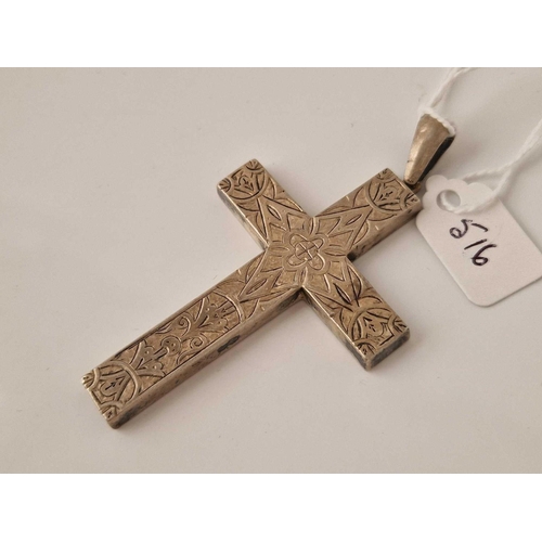 516 - A fancy silver cross