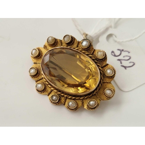 522 - A citrine and pearl pendant brooch 9ct 6.1 gms