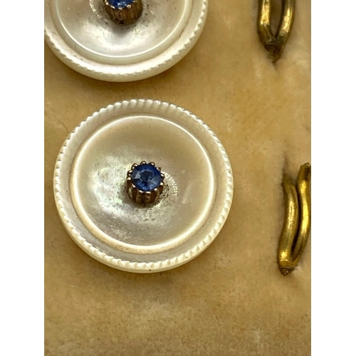 548 - A set of six studs MOP and sapphires boxed