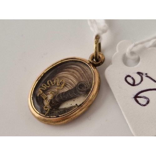 56 - A VICTORIAN GOLD AND ENAMEL LOCKET