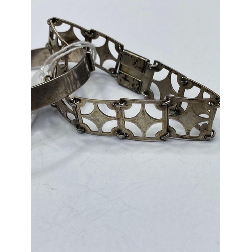 606 - A silver bangle and bracelet