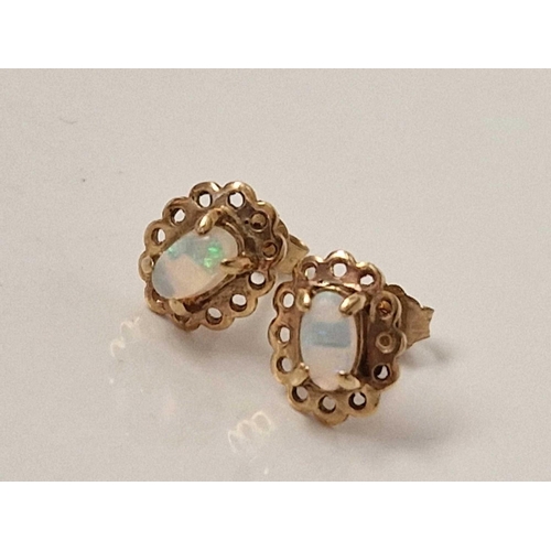 614 - A pair of opal earrings 9ct