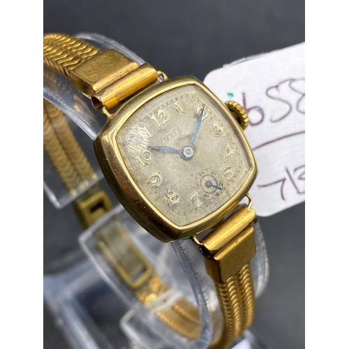 658 - A ladies ROLEX wrist watch 9ct with metal strap