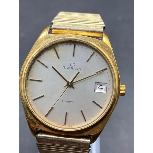 680 - A gents GARRARD wrist watch with seconds sweep and date aperture