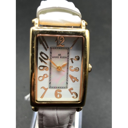 686 - A ANNE KLEIN ladies rectangular MOP dial wrist watch on original strap