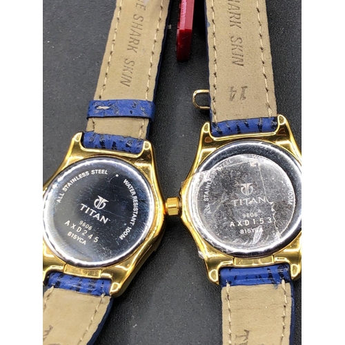 698 - Two TITAN wrist watches with black dials