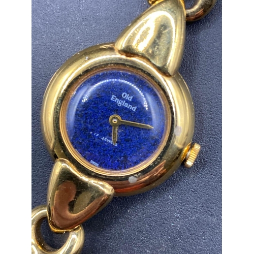 699 - A old English gold coloured wrist watch with blue dial