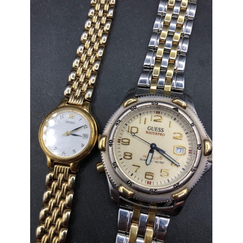 713 - Two gents and ladies SEIKO and a GUESS wrist watch