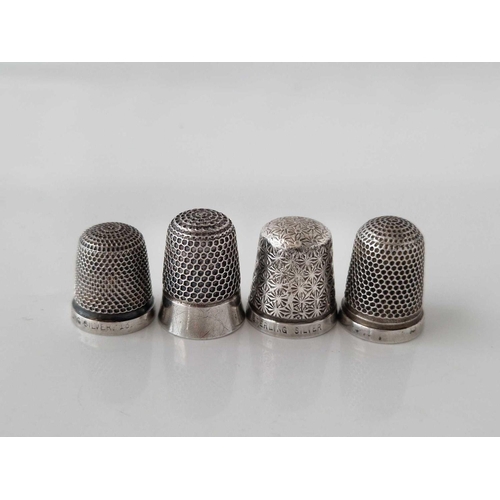 830 - Four various silver thimbles