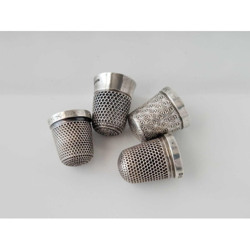 830 - Four various silver thimbles