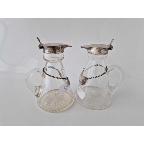 845 - A good set of four whisky jugs with glass bodies and silver labels, Birmingham 1930