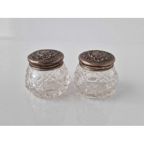 846 - A pair of embossed jars with glass bodies, 1.5 inches wide, Birmingham 1910