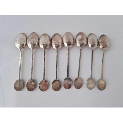 849 - A set of eight Chinese and MOP decorated topped spoons, stamped sterling, 61 g.