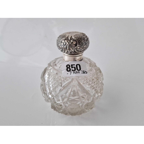 850 - An Edwardian silver topped scent bottle with embossed cover and a stopper, 4 inches high, Birmingham... 