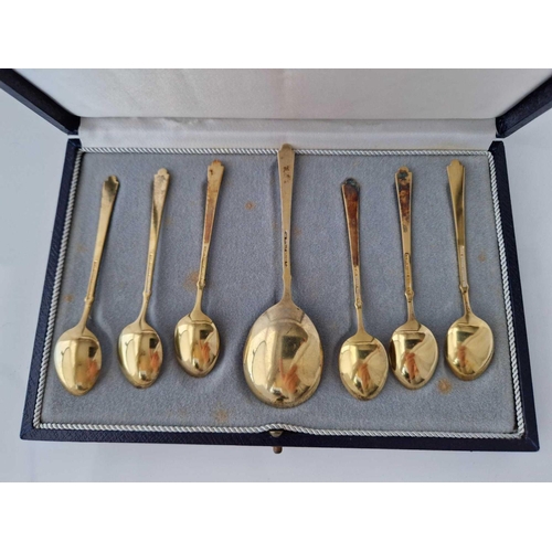 851 - A boxed set of Danish silver gilt and enamel spoons, stamped sterling by ELA?