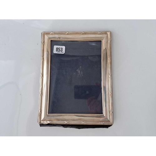 853 - A photo frame with reeded and ribbon border, 10 inches high, Birmingham 1964