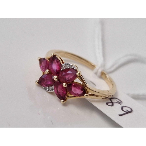 89 - A pink stone dress ring with diamond chips 9ct size O