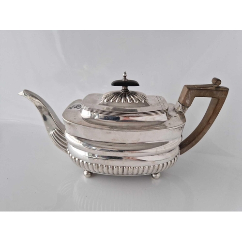 892 - An oblong George III tea pot with half fluted decoration, London 1807 by CH, 634g