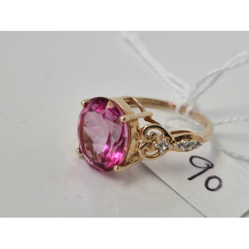 90 - A large pink stone dress ring with diamond chips 9ct size O 3.6 gms