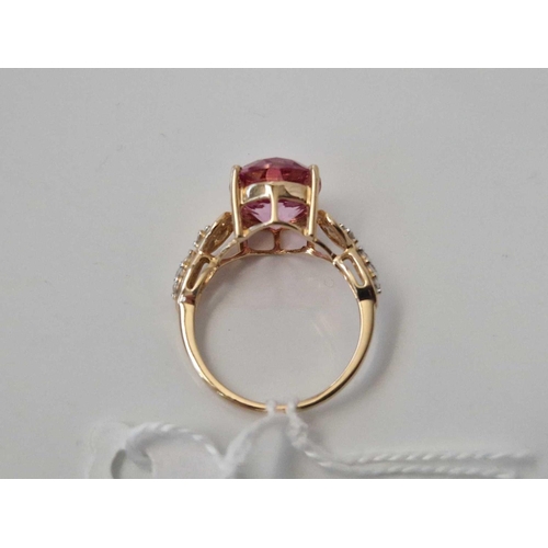 90 - A large pink stone dress ring with diamond chips 9ct size O 3.6 gms