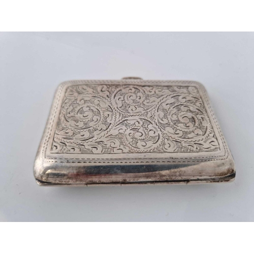 911 - A cigarette case engraved with scrolls, 3 1/4