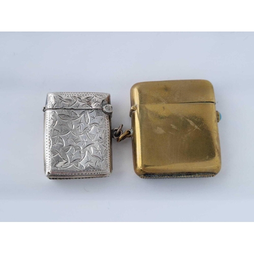 916 - An engraved vesta case, Birmingham 1905 and a brass example