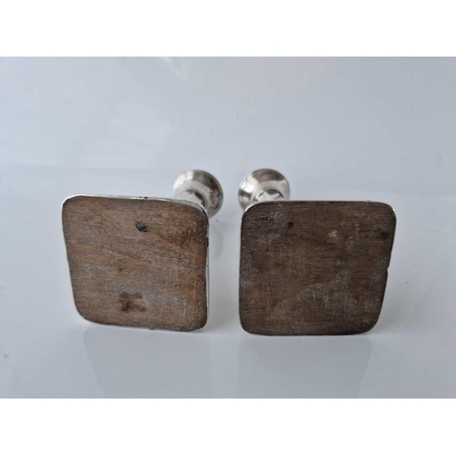 922 - A pair of square based candlesticks, octagonal stems, 5