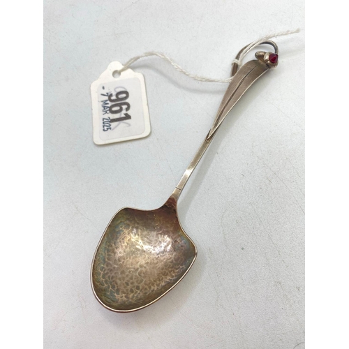 961 - A stylish art nouveau style spoon with hammered bowl, inset with garnet?