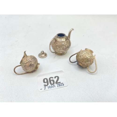 962 - A miniature Chinese teaset with chased decoration of flowers