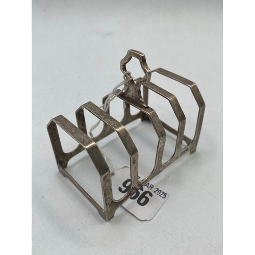 966 - A five bar toast rack on bracket feet, 3 inches wide, Birmingham 1934, 50 g.