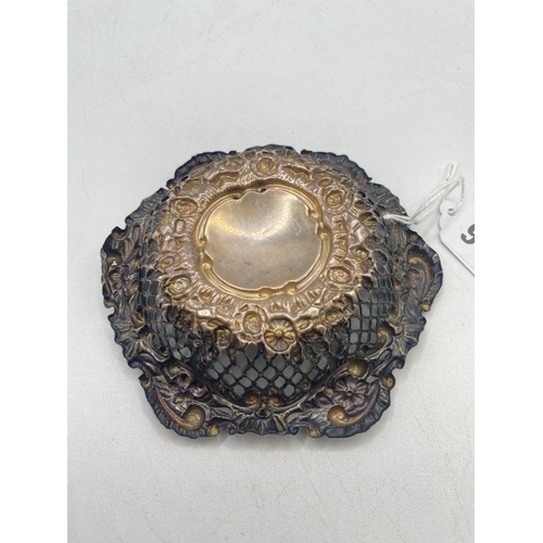 968 - A shaped circular embossed and pierced bon bon dish, 4.5 inches wide, 34 g