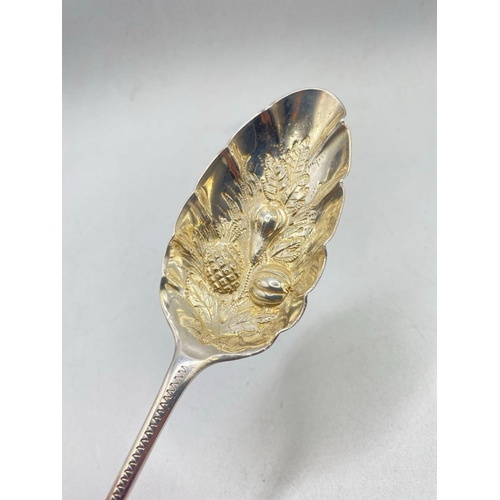 974 - A Victorian berry spoon with embossed bowl, Birmingham 1899