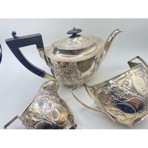 978 - An Art Nouveau style embossed teaset on rim foot, Sheffield 1901 by JB WB, 975 g.