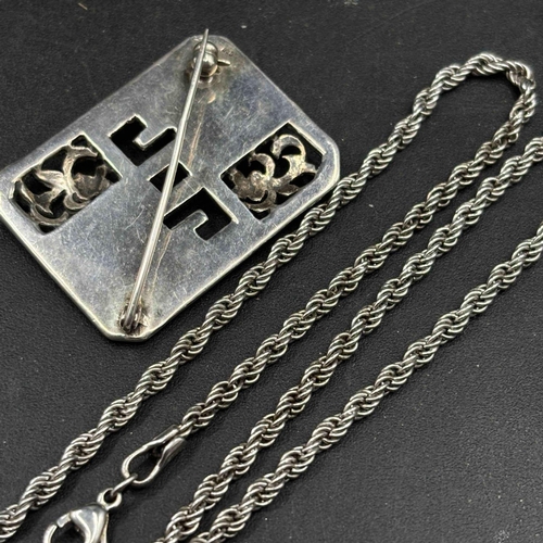 16 - A silver neck chain and pendant and marcasite brooch 49 gms