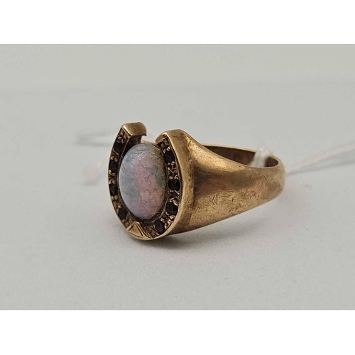 34 - A horse shoe ring with opal and garnets 9ct size P 6.3 gms