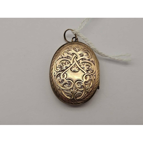 35 - A back and front black enamel mourning locket 9ct 6.9 gms