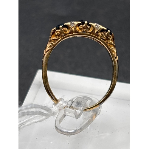 52 - A VICTORIAN SAPPHIRE AND DIAMOND THREE STONE RING WITH SCROLLED SETTING 18CT GOLD SIZE R 4.4 GMS BOX... 