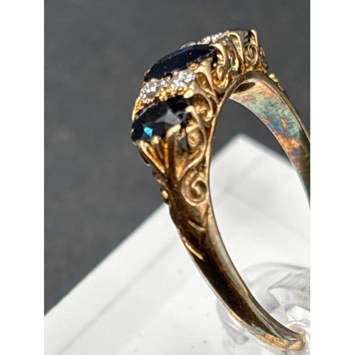 52 - A VICTORIAN SAPPHIRE AND DIAMOND THREE STONE RING WITH SCROLLED SETTING 18CT GOLD SIZE R 4.4 GMS BOX... 
