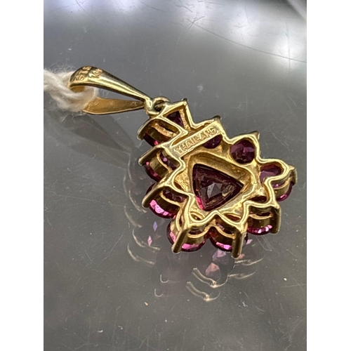 2 - A red stone pear shaped pendant set in gold 14 gms