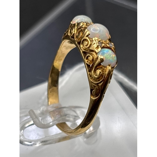 23 - 18ct 3 stone opal half hoop ring with diamond highlights, size Q, 5.2g