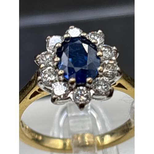 24 - 18ct Sapphire and diamond oval cluster ring, size I, 4.3g