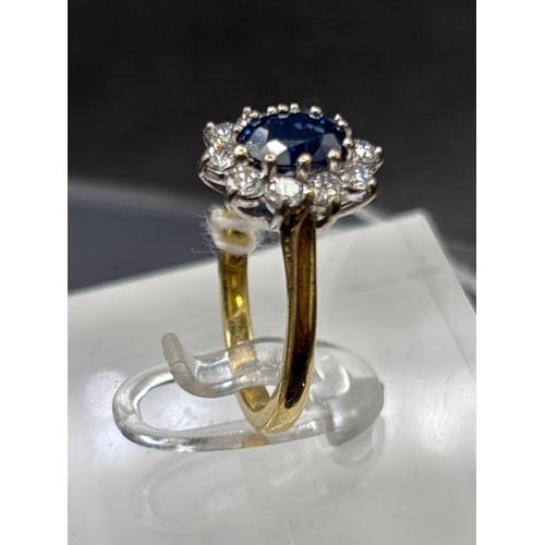 24 - 18ct Sapphire and diamond oval cluster ring, size I, 4.3g